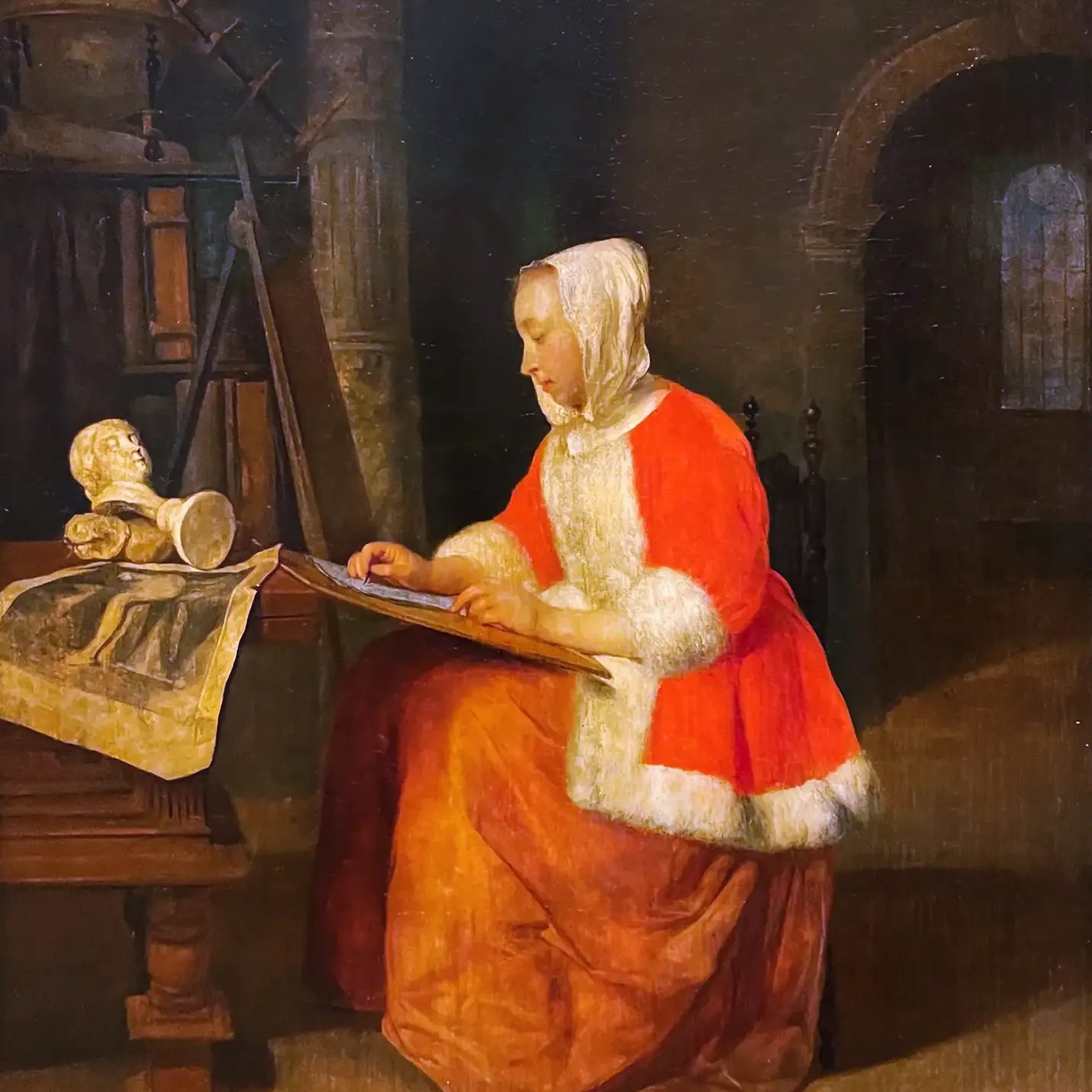 Габриэль Метсю — Сидящая рисующая женщина, около 1655-1660 (холст, масло)